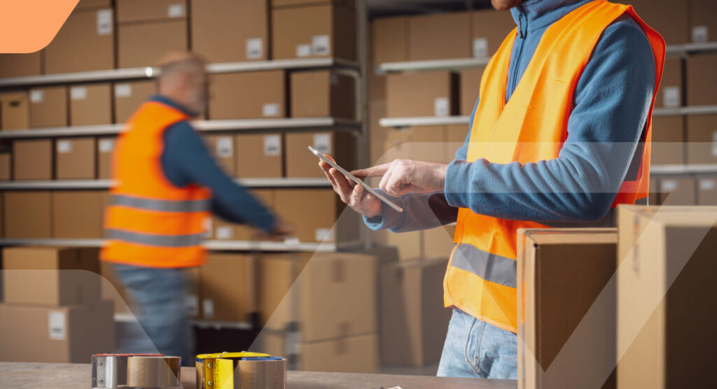 Warehouse staff member preparing or packing orders at a station
